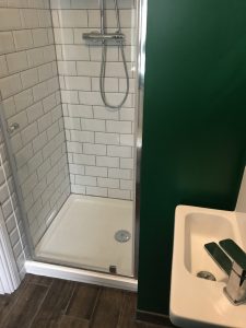 A new mixer shower and enclosure tiled with metro tiles. Part of a recent bathroom installation in Bicester.